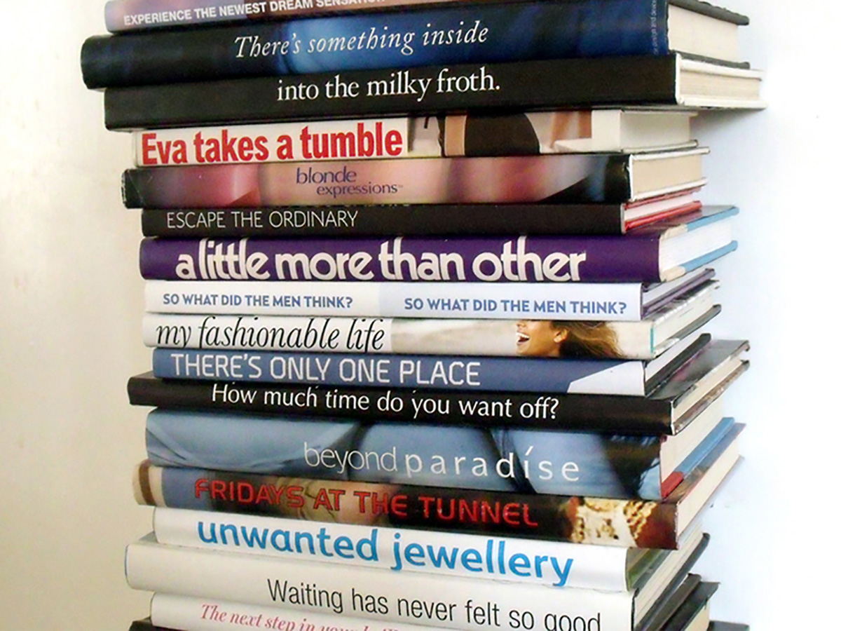 Photo of a stack of books. The names on their spines are arranged so that they read 'There's something inside into the milky froth. Eva takes a tumble blonde expressions escape the ordinary a little more than other so what did the men think? My fashionable life there's only one place how much time do you want off? beond paradise fridays at the tunnel unwanted jewellery waiting had never felt so good.'