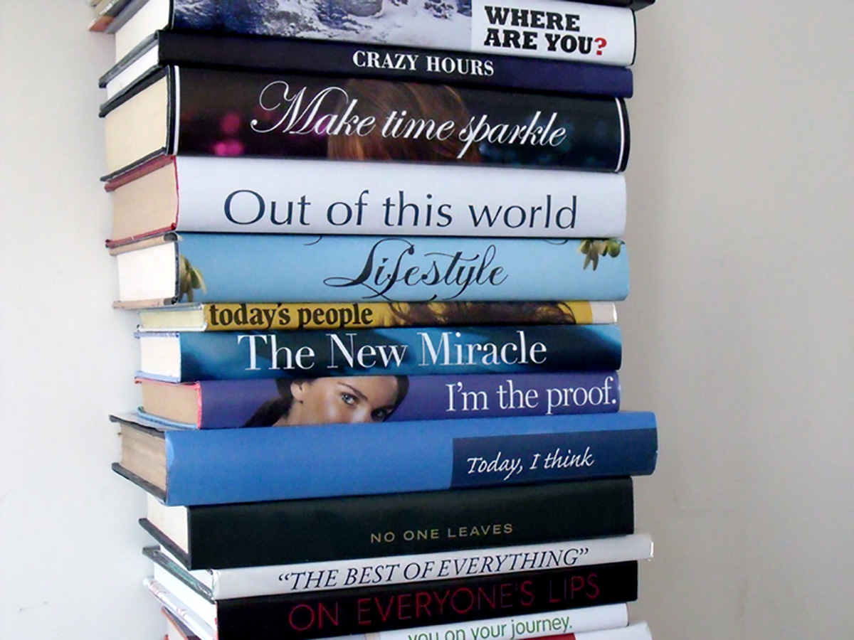 Photo of a stack of books. The names on their spines are arranged so that they read 'WHERE ARE YOU? CRAZY HOURS Make time sparkle out of this world lifestyle today's people the new miracle I'm the proof. Today, I think no one leaves "THE BEST OF EVERYTHING" on everyone's lips'